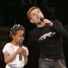 Alexey Khlystov sang with a little girl in duet. [Press for large view]