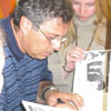 Some visitors were lucky to get an autograph from the favorite artist. &nbsp;[Press for large view]