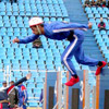 Running at the 100-meter obstacle course at the second world championship of firefighters and rescue teams.&nbsp;[Press for large view]